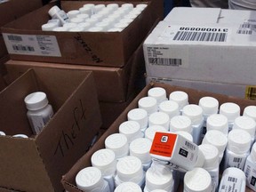 FILE - In this Sept. 1, 2004, file photo, medical bottles bearing tracking codes in the McKesson medical distribution center in Delran, N.J. President Donald Trump has made big promises to reduce prescription drug costs, but his administration is gravitating to relatively modest steps such as letting Medicare patients share in manufacturer rebates.
