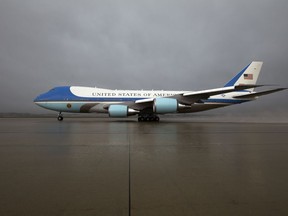 FILE - In this April 6, 2017 file photo, Air Force One, with President Donald Trump aboard, departs from Andrews Air Force Base, Md., en route to Mar-a-Largo, in Palm Beach, Fla., for a meeting with Chinese President Xi Jinping. Trump has reached an informal deal with Boeing to provide the next generation presidential aircraft. Deputy press secretary Hogan Gidley says the $3.9 billion "fixed price contract" for the new planes, known as Air Force One when the president is on board, "will save the taxpayers more than $1.4 billion."