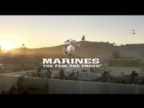 This image from a video released by the U.S. Marine Corps, that will be shown online only Sunday during the Super Bowl and targeting a young, tough, tech-savvy audience for potential recruits who are looking for a challenge. The high-powered, battle-heavy spot shows Marines deploying off ships in amphibious vehicles, dropping bombs from aircraft and hurling a shoulder-launched drone into the air. (U.S. Marine Corps via AP)