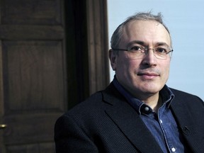 In this picture taken on Thursday, Feb. 15, 2018, exiled former Russian oligarch Mikhail Khodorkovsky looks on during an interview with the Associated Press in London. Russian oligarch-turned-dissident Mikhail Khodorkovsky says he's not interested in replacing Vladimir Putin as president. Khodorkovsky told The Associated Press in an interview Thursday that he might line up behind TV star Ksenia Sobchak in next month's presidential election _ or he might just cast a spoiled ballot.