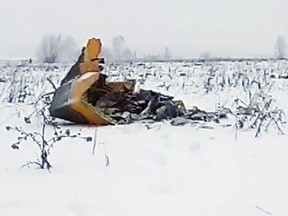 In this screen grab provided by the Life.ru, the wreckage of a AN-148 plane is seen in Stepanovskoye village, about 40 kilometers (25 miles) from the Domodedovo airport, Russia, Sunday, Feb. 11, 2018. Russia's Emergencies Ministry says a passenger plane has crashed near Moscow and fragments of it have been found. (Life.ru via AP)