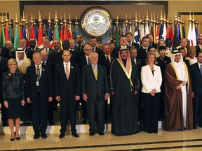 Members of a U.S.-led coalition fighting against the Islamic State group pose for a group photograph in Kuwait City, Kuwait, Tuesday, Feb. 13, 2018. Members of the U.S.-led coalition group met Tuesday at Kuwait's Bayan Palace as American officials are pressing their partners to refocus efforts, overcome rivalries and concentrate on the eradication from Iraq and Syria of the extremist group.