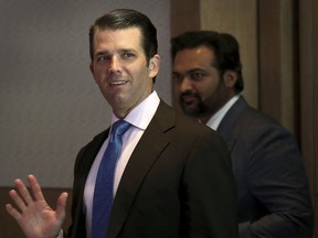 Donald Trump Jr. waves to media as he arrives for a meeting in New Delhi, India, Tuesday, Feb. 20, 2018. The eldest son of U.S. President Donald Trump has arrived in India to help sell luxury apartments and lavish attention on wealthy Indians who have already bought units in a string of Trump-branded developments.