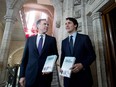 Minister of Finance Bill Morneau walks with Prime Minister Justin Trudeau before tabling the budget in the House of Commons on Parliament Hill in Ottawa on Tuesday, Feb. 27, 2018.  The budget announced the creation of a “patent collective.”