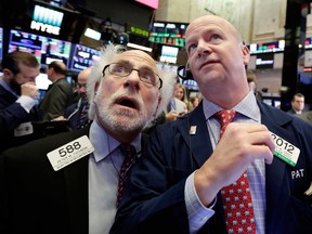 Traders work on the floor of the New York Stock Exchange.