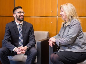Student Gurjodh Mahal speaks with Tamara Vrooman, president and CEO of Vancity, in Vancouver.