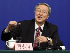Zhou Xiaochuan, governor of the People's Bank of China speaks during a press conference held on the sidelines of the annual meeting of China's National People's Congress (NPC) in Beijing, Friday, March 9, 2018. China's central bank governor says the country can be bolder in opening its financial markets following steps to strengthen its regulatory system and encourage use of its currency abroad.