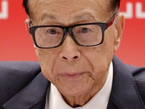 FILE - In this Wednesday, March 22 ,2017, file photo, Hong Kong tycoon Li Ka-shing, chairman of CK Hutchison Holdings company, speaks during a press conference to announce the company's annual results in Hong Kong. Li says he is retiring as chairman of his conglomerate just shy of his 90th birthday. Li made the announcement at a packed press conference on Friday after his company, CK Hutchison Holdings, released its annual results.
