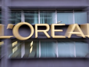 French cosmetics conglomerate L'Oreal is buying Canadian augmented reality and artificial intelligence firm ModiFace, which caters to the beauty industry. The logo of cosmetics group L'Oreal is pictured with a zoom effect during a visit at L'oreal Headquarters in Clichy, north outskirts of Paris, France, Monday, Nov. 3, 2014.
