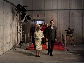 Queen Elizabeth and Ontario Premier Dalton McGuinty arrive for a luncheon reception at Pinewood Toronto Studios, Canada's largest film and television production complex, on Monday, July 5, 2010. Bell Media has set the stage to acquire a majority stake in Pinewood Toronto Studios, which has been used to film "Star Trek Discovery" and "The Expanse."