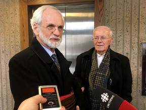 Former Knowledge House Inc. president and CEO Daniel Potter, left, speaks to reporters at the courthouse in Halifax on Friday, March 9, 2018. Potter and lawyer Blois Colpitts were found guilty Friday in a multi-million-dollar stock market fraud case.