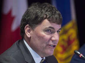 Fisheries Minister Dominic LeBlanc fields a question at a news conference at a meeting of Atlantic Canadian politicians dealing with regional economic growth in Moncton, N.B. on Tuesday, Feb. 20, 2018. The Newfoundland and Labrador government is demanding Ottawa reverse its decision to award a lucrative Arctic surf clam fishing licence to a Nova Scotia-based company that says it has Indigenous partners from every Atlantic province and Quebec.
