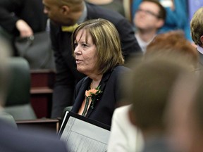 Minister of Energy Marg McCuaig-Boyd leaves the room after the speech from the throne in Edmonton, Alta., on Monday, June 15, 2015. Alberta is committing up to $1 billion to grow its downstream oil production. Energy Minister Marg McCuaig-Boyd says the money will be used for loan guarantees, grants and royalty credits to spur more private sector investments to process more of Alberta's crude.THE CANADIAN PRESS/Jason Franson