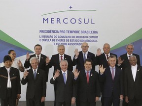 From bottom left, Bolivia's President Evo Morales, Uruguay's President Tabare Vazquez, Brazil's President Michel Temer, Paraguay's President Horacio Cartes, Argentina's President Mauricio Macri and Guyana's President David Arthur Granger, and from top left, Suriname's Minister in Charge of Business Natasha Halfhuid, Ecuador's Negotiator for Mercosur Diego Ribadaneira, Chile's Foreign Minister Heraldo Munuz, Colombia's Embassador to Brasil Alejandro Borda, Peru's Negotiator for Mercosur Luis Quesada and Egypt's Minister of Trade and Industry Tarek Kabil pose for an official photo of the Mercosur and Associated States Summit of Heads of State, at the Itamaraty Palace, in Brasilia, Brazil on December 21, 2017. Canada is expected to announce the start of formal free trade negotiations on Friday with the four-country South American trade bloc known as Mercosur. A spokesman for International Trade Minister Francois-Philippe Champagne says the negotiations could begin in earnest in the next 10 days.