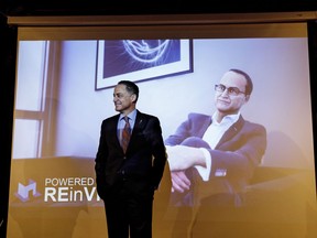 Alberta President of Treasury Board and Minister of Finance Joe Ceci stands in front of a virtual reality character of him, during a pre-budget event in Edmonton Alta, on Tuesday March 20, 2018.