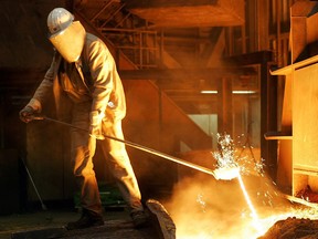 FILE - In this Sept. 22, 2005 file photo a steel worker takes a sample at the blast furnace of ThyssenKrupp steel company in Duisburg, western Germany. Ordering combative action on foreign trade, President Donald Trump has declared that the U.S. will impose steep tariffs on steel and aluminum imports, escalating tensions with China and other trading partners and raising the prospect of higher prices for American consumers and companies.