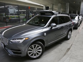 FILE - In this Dec. 13, 2016 file photo, an Uber driverless car heads out for a test drive in San Francisco. Police in a Phoenix suburb say one of Uber's self-driving vehicles has struck and killed a pedestrian. Police in the city of Tempe said Monday, March 19, 2018, that the vehicle was in autonomous mode with an operator behind the wheel when the woman walking outside of a crosswalk was hit.