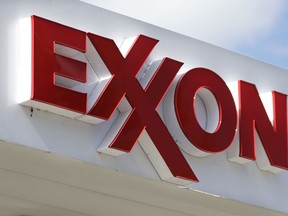 FILE - This April 25, 2017 file photo shows an Exxon service station sign in Nashville, Tenn. U.S. oil company Exxon Mobil has said on Thursday, March 1, 2018 it will withdraw from its joint venture with Russia's state-controlled Rosneft amid expanded U.S. and European sanctions against the country. Exxon Mobil had signed a deal with Rosneft, Russia's biggest oil producer, in 2011 that would drill in the country's Arctic waters.