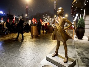 A replica of the "Fearless girl" sculpture by US artist Kristin Visbal stands in front of Grand Hotel in Oslo, Thursday 8 March, 2018. The sculpture was unveiled earlier Thursday.