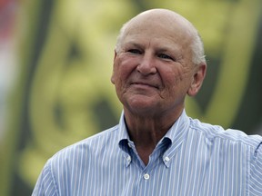 FILE- This Sept. 16, 2007, file photo shows H. Wayne Huizenga on the sidelines before a football game between the Miami Dolphins and the Dallas Cowboys at Dolphin Stadium in Miami. Huizenga, a college dropout who built a business empire that included Blockbuster Entertainment, AutoNation and three professional sports franchises, has died. Valerie Hinkell, a longtime assistant to Huizenga, said Friday that he died Thursday night, March 22, 2018, at his South Florida home. He was 80.