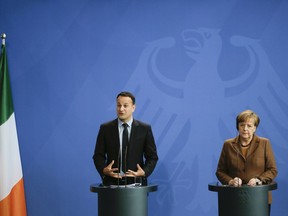 German Chancellor Angela Merkel, right, and the Prime Minister of Ireland, Leo Varadkar, left, address the media after talks at the chancellery in Berlin, Germany, Tuesday, March 20, 2018.