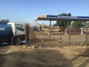 FILE - In this Sunday Oct. 1, 2017 file photo, a truck waits outside a closed petrol station of the Nile Petroleum Corporation in Juba, South Sudan. South Sudan's state-owned oil company has been "captured by predatory elites" and is being used to fund the country's civil war, according to reports by two investigative organizations.