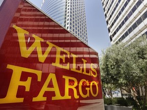 FILE - This July 14, 2014 file photo shows Wells Fargo offices in Oakland, Calif.   The Wall Street Journal is reporting, Friday, March 16, 2018,  that a federal investigation into Wells Fargo has broadened beyond its retail banking unit, to include its wealth-management division. Wells Fargo continues to deal with the aftermath of its sales practices scandal where employees opened up millions of fake accounts without customer authorization.