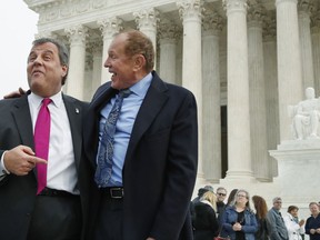 FILE - In this Dec. 4, 2017, file photo, New Jersey Gov. Chris Christie, left, and state Sen. Raymond Lesniak talk after a news conference at the Supreme Court where a case on sports betting is being heard in Washington. New Jersey has challenged the Professional and Amateur Sports Protection Act, the 1992 law forbidding all but Nevada and three other states from authorizing gambling on college and professional sports. Only Nevada offers betting on single games.