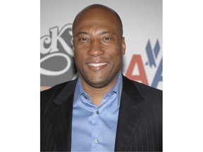 FILE - In this May 8, 2009, file photo, Byron Allen arrives for an event in Los Angeles. Allen's Entertainment Studios, Inc., one of the largest independent producers and distributors of film and television, on Thursday, March 22, 2018, announced its acquisition of the Weather Group, parent company of The Weather Channel television network and LOCAL NOW streaming service.