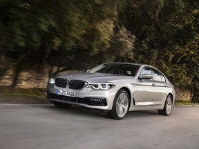 This undated photo provided by BMW shows the BMW 530e iPerformance, a plug-in hybrid vehicle. The German automaker takes an atypical strategy, with the hybrid versions positioned somewhat lower price wise in their respective model lineups. For instance, the sticker price of the hybrid 530e iPerformance starts at the same price as the least expensive 5 Series you can buy.