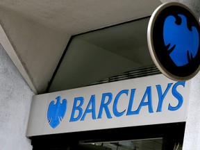 FILE - This July 29, 2015, file photo shows the sign on a branch of Barclays Bank in London. Barclays has agreed to pay $2 billion in civil penalties to the U.S. government to settle a lawsuit alleging that it was involved in a fraudulent scheme to sell residential mortgage-backed securities. The announcement was made Thursday, March 29, 2018, by the U.S. attorney's office in Brooklyn.
