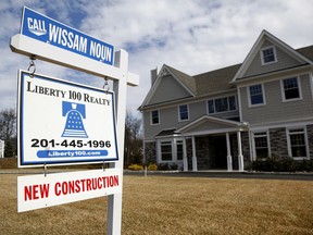 FILE- This Feb. 26, 2018, photo shows a new home are for sale in Mahwah, N.J. On Friday, March 23, the Commerce Department reports on sales of new homes in February.