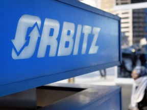 FILE - This Feb. 12, 2015 file photo shows signage for travel booking site Orbitz outside the building that houses its headquarters, in Chicago. Orbitz says a legacy travel booking platform may have been hacked, potentially exposing the personal information of people that made purchases between Jan. 1, 2016 and Dec. 22, 2017. The company said Tuesday, March 20, 2018, about 880,000 payment cards were impacted.