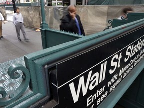 FILE- In this Oct. 2, 2014, file photo, the Wall Street subway stop on Broadway, in New York's Financial District. The U.S. stock market opens at 9:30 a.m. EDT on Wednesday, March 28, 2018.