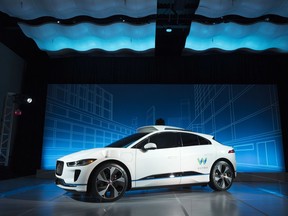 The Jaguar I-Pace vehicle is introduced Tuesday, March 27, 2018, in New York. Self-driving car pioneer Waymo will buy up to 20,000 of the electric vehicles from Jaguar Land Rover to help realize its vision for a robotic ride-hailing service. The commitment announced Tuesday marks another step in Waymo's evolution from a secret project started in Google nine years ago to a spin-off that's gearing up for an audacious attempt to reshape the transportation business.