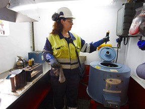 A chemist tests an oil sample on the Casablanca oil platform, operated by Repsol, in the Mediterranean Sea.