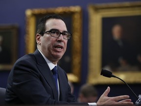 FILE - In this March 6, 2018, file photo, Treasury Secretary Steven Mnuchin testifies during a hearing before the House Appropriations subcommittee on budget on Capitol Hill in Washington. UCLA has released video showing the near-constant heckling of Mnuchin during a Feb. 26, 2018, moderated talk about the economy.