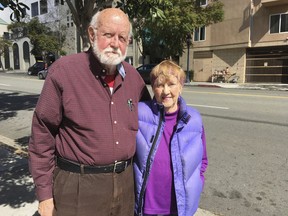 HOLD FOR USE WITH STORY MOVING WEDNESDAY, MARCH 7, 2018-In this Feb. 23, 2018 photo Air Force veteran Ed Warren, 82, and his wife, Jac Warren, 81, pose for a photo while visiting San Diego, to attend the Democrats' annual convention and talk to lawmakers. The couple is voicing opposition to a regulation that requires veterans in state homes to be discharged before they can use a new state law allowing physician-assisted deaths for the terminally ill. The California Department of Veterans Affairs officials say the Department of Veterans Affairs does not allow federal funds to be used for assisted suicides. The couple lives at the nation's largest retirement home in Yountville, California.