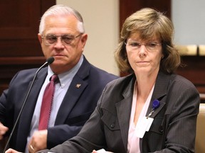 FILE - In a Wednesday, Oct. 11, 2017 file photo, Arkansas Department of Correction Director Wendy Kelley, right, testifies before legislators at the state Capitol complex in Little Rock with deputy director Dale Reed at her side. The Arkansas Supreme Court ruled Thursday, March 29, 2018, that Kelley's agency must identify the companies that manufacture Arkansas' execution drugs but that information that identifies the middlemen can be withheld.