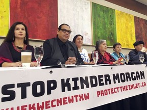 Indigenous leaders speak at a news conference in Vancouver, British Columbia, Canada, on Friday, March 9, 2018, prior to a planned protest over a pipeline expansion project that would pump oil from Canada's tar sands to the Pacific Coast. Thousands are expected to march Saturday in the Metro Vancouver area.