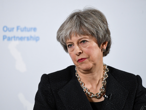 Britain's Prime Minister Theresa May listens to a question after giving a speech on Brexit, March 2, 2018.