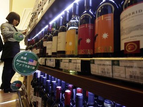 FILE - In this Jan. 30, 2011, file photo, wine imported from the U.S. is displayed at a supermarket in Beijing. China announced a list of U.S. goods including pork, apples and steel pipe on Friday, March 23, 2018, that it said may be hit with higher import duties in response to President Donald Trump's tariff hike on steel and aluminum.