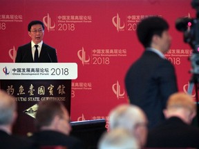 Chinese Vice Premier Han Zheng delivers his opening speech in the China Development Forum held at the Diaoyutai State Guesthouse in Beijing, Sunday, March 25, 2018. A top Chinese official has warned a "trade war" would harm all sides but gave no indication of Beijing's possible next move in a spiraling dispute with President Donald Trump over steel and technology. Speaking to global business leaders at an economic forum, Han appealed for cooperation to make economic globalization "beneficial for all."