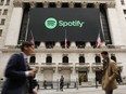 The Spotify banner hangs from the New York Stock Exchange (NYSE) on the morning that the music streaming service begins trading shares at the NYSE on April 3, 2018 in New York City.
