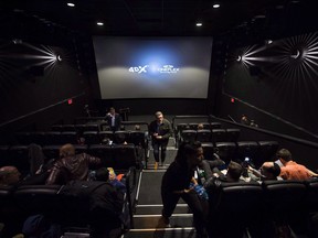 eople mill about inside a Cineplex theatre as it opens its first 4DX sensory experience theatre in Toronto.