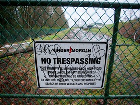 A "No Trespassing" sign is displayed on a fence outside of the Kinder Morgan Inc. facility in Burnaby, British Columbia, Canada, on Wednesday, April 11, 2018.