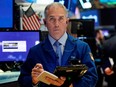 A trader works on the floor of the New York Stock Exchange.