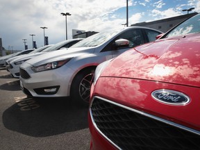 Ford Focus compact cars are offered for sale at a dealership in Chicago.