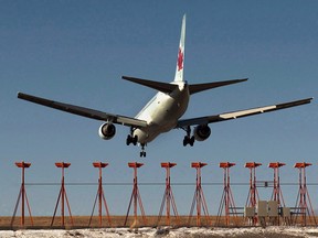 An Air Canada passenger jet lands at Halifax Stanfield International Airport in Halifax on Monday, Jan. 21, 2013.