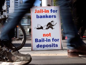 A photo taken in Melbourne on April 23, 2018 show a placard outside the royal commission set up in February to investigate misconduct in the banking sector. Australian finance company AMP's chairman Catherine Brenner quit on April 30, 2018, barely a week after its chief executive stood down as damning evidence of misconduct by the firm continues to mount.